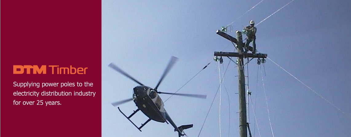 Photo of a power pole installation using the assistance of a helicopter